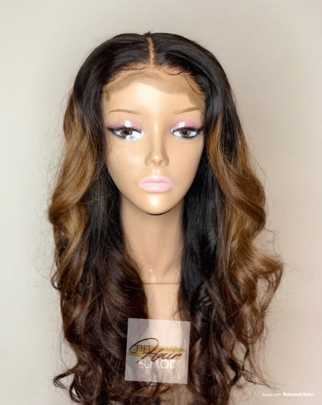 Bella wig with long wavy dark brown hair, middle part and natural hairline