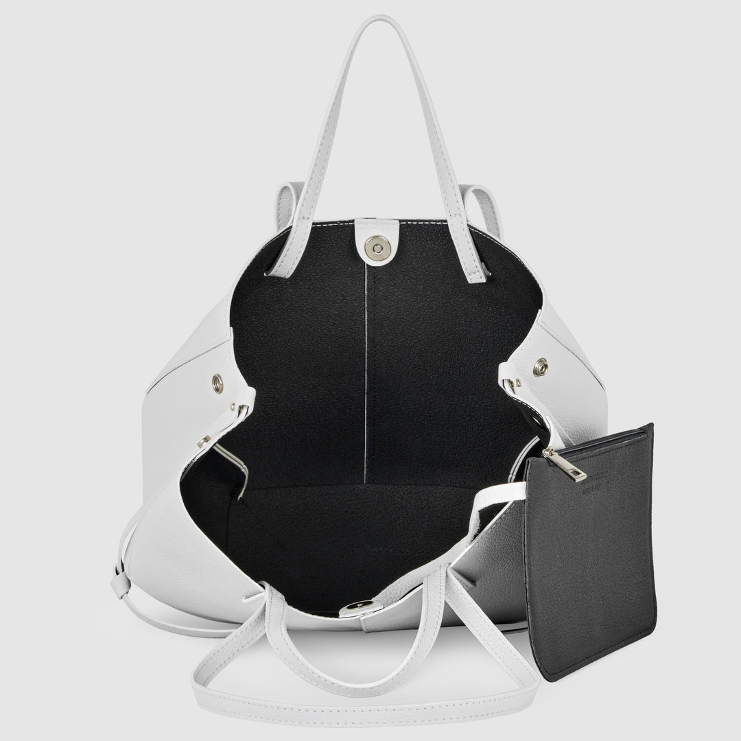 White calf leather tote bag with black interior and matching small zip pouch