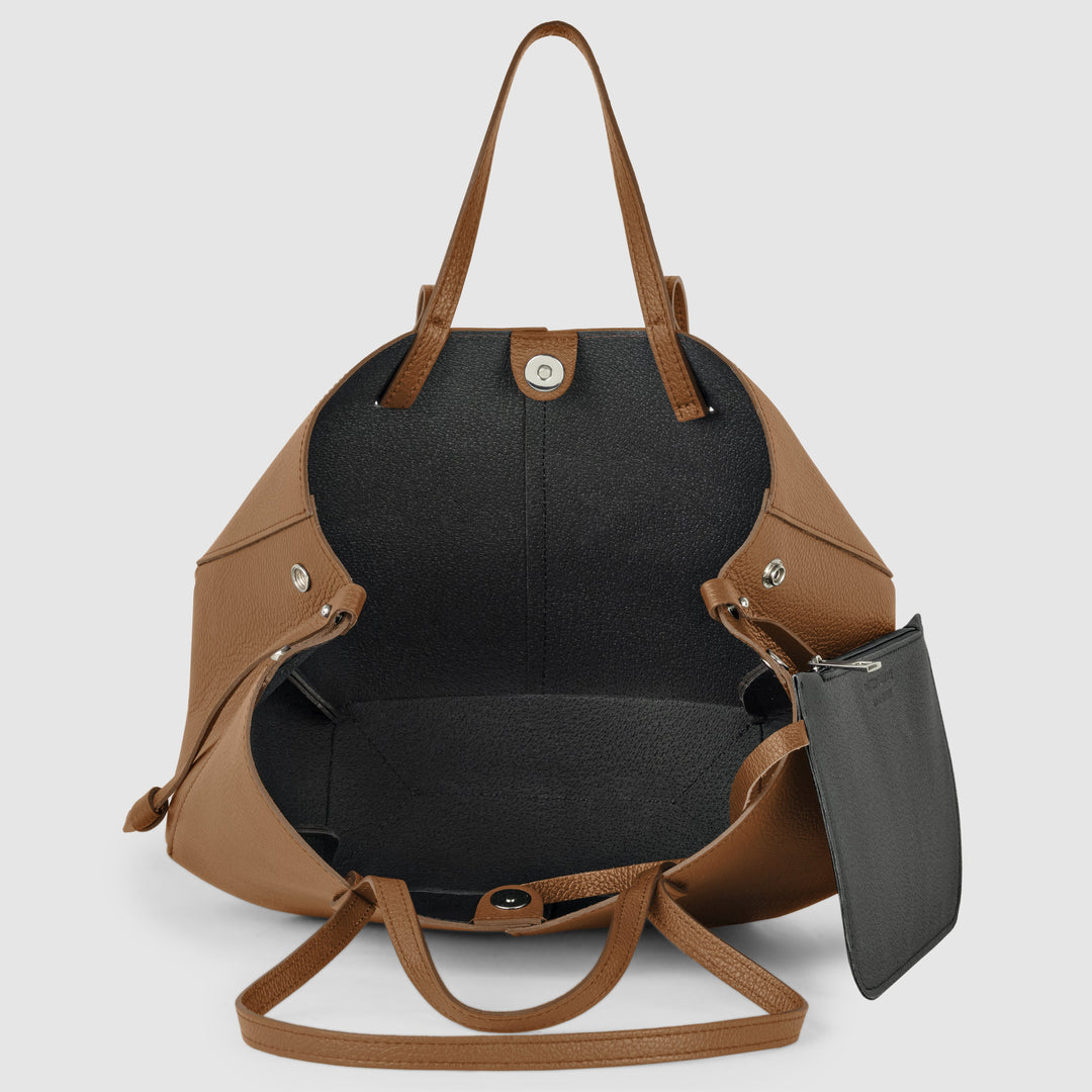 Tote bag opening with black interior lining and top clasp, chocolate brown calf leather.