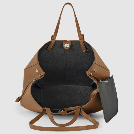 Tote bag opening with black interior lining and top clasp, chocolate brown calf leather.