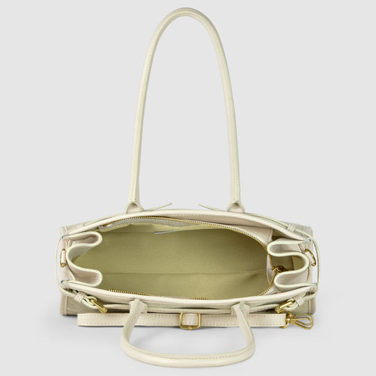 Beige shoulder bag open interior view with zip closure and side pockets