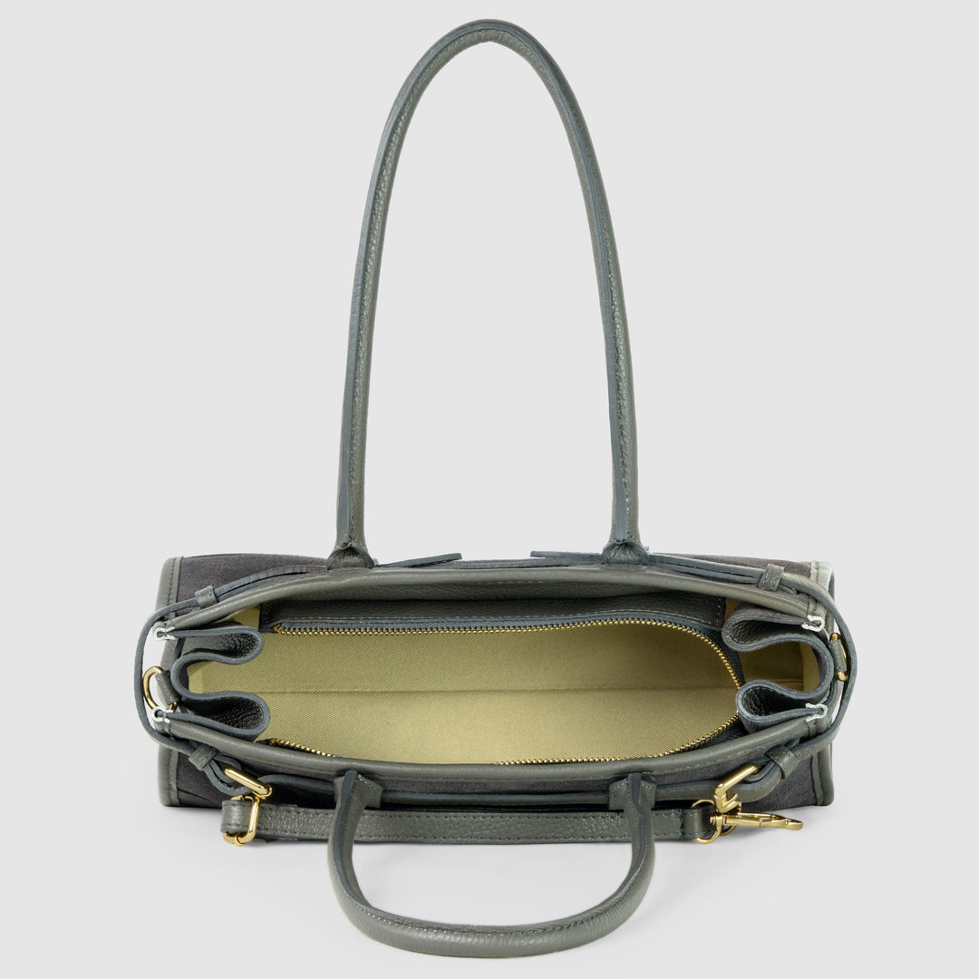 Dark grey shoulder bag open interior view with zip top, gold-tone hardware, side buckles