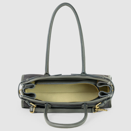 Dark grey shoulder bag open interior view with zip top, gold-tone hardware, side buckles