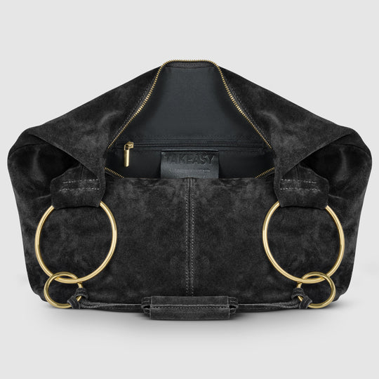 Black suede hobo bag interior view with front zipper pocket, gold hardware, and ring handles