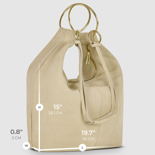 Beige suede hobo bag side view with measurements and ring handle straps