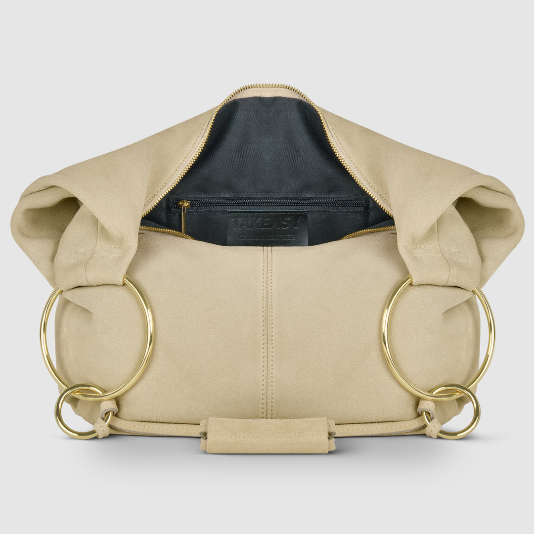 Beige suede hobo bag interior view with zip pocket and gold zipper