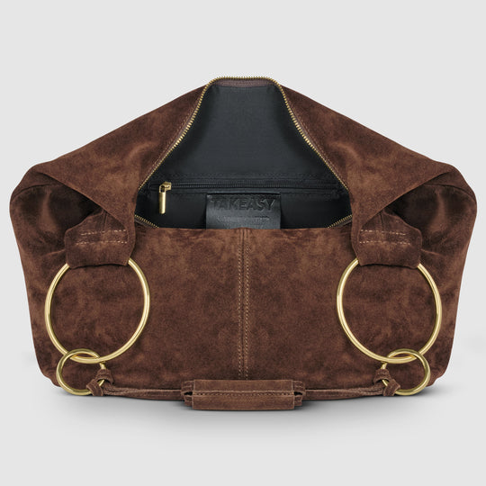 Brown suede hobo bag with zip-top opening, interior lining, and long ring handles