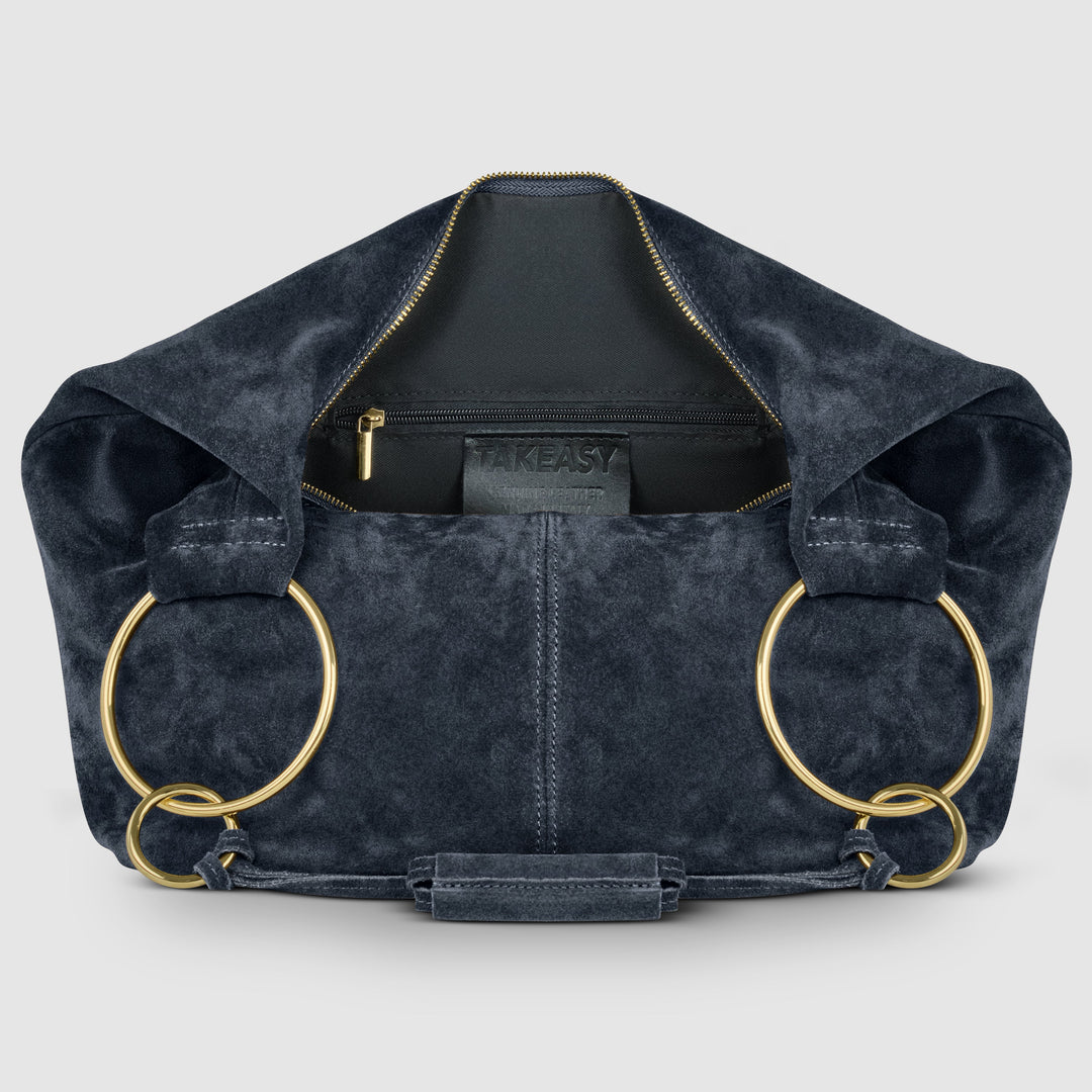 Dark blue suede hobo bag interior view with zip pocket and gold zipper