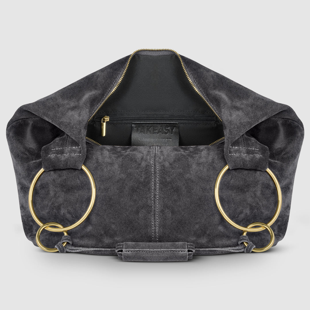 Dark suede hobo bag interior view with zip pocket and gold-tone ring accents
