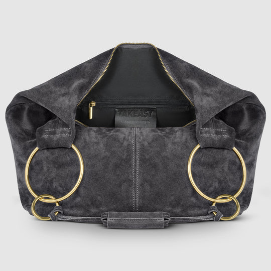 Dark suede hobo bag interior view with zip pocket and gold-tone ring accents