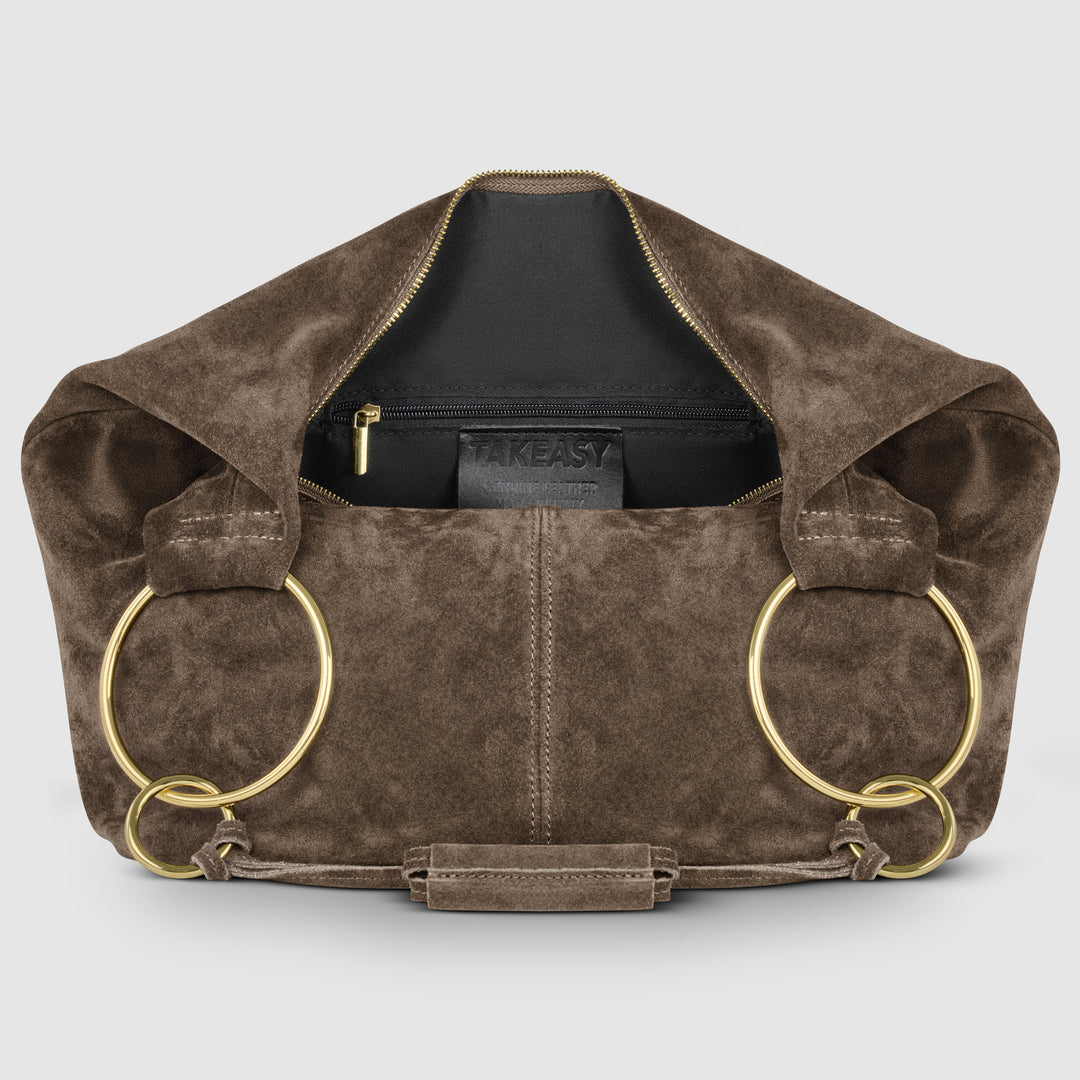 Brown suede hobo bag interior view with zip pocket and gold-tone ring accents