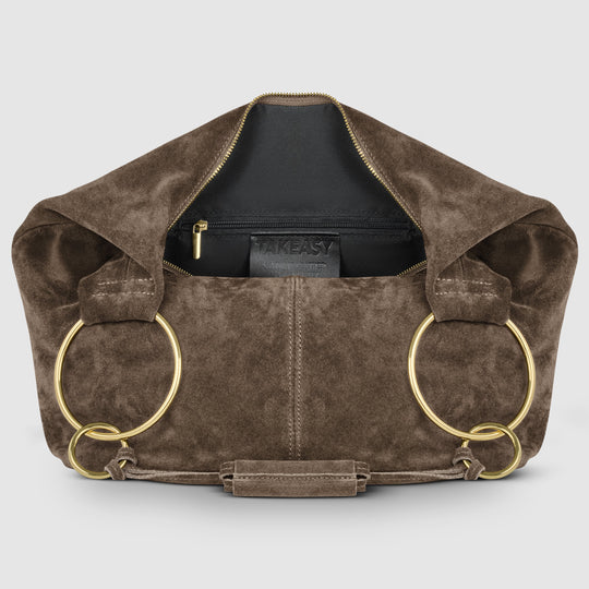 Brown suede hobo bag interior view with zip pocket and gold-tone ring accents