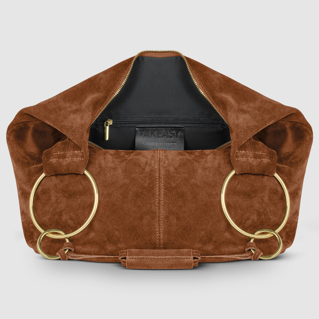 Chocolate suede hobo bag with zip-top opening and interior brand label