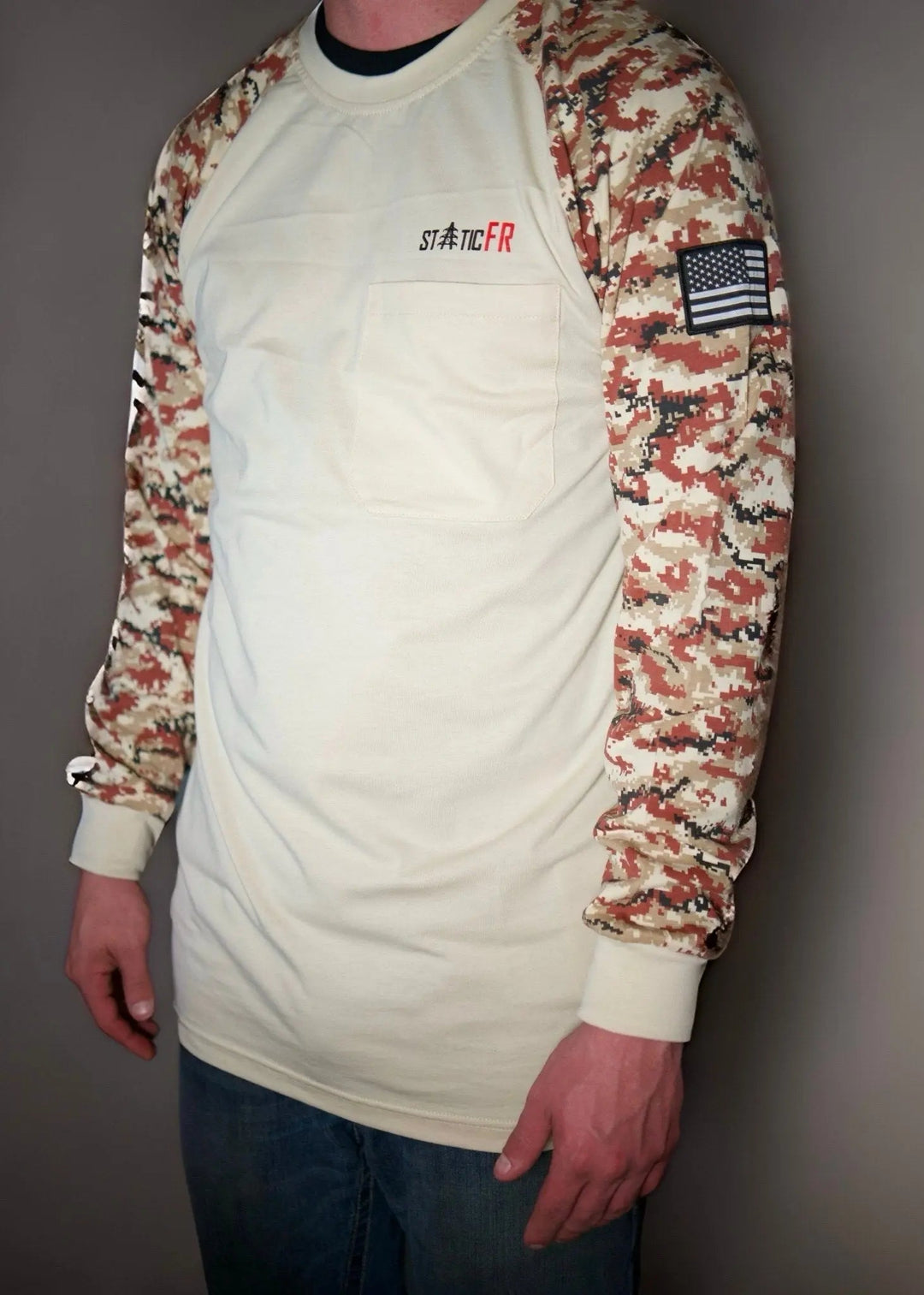 White long-sleeve shirt with tan/black digital camo raglan sleeves and chest logo