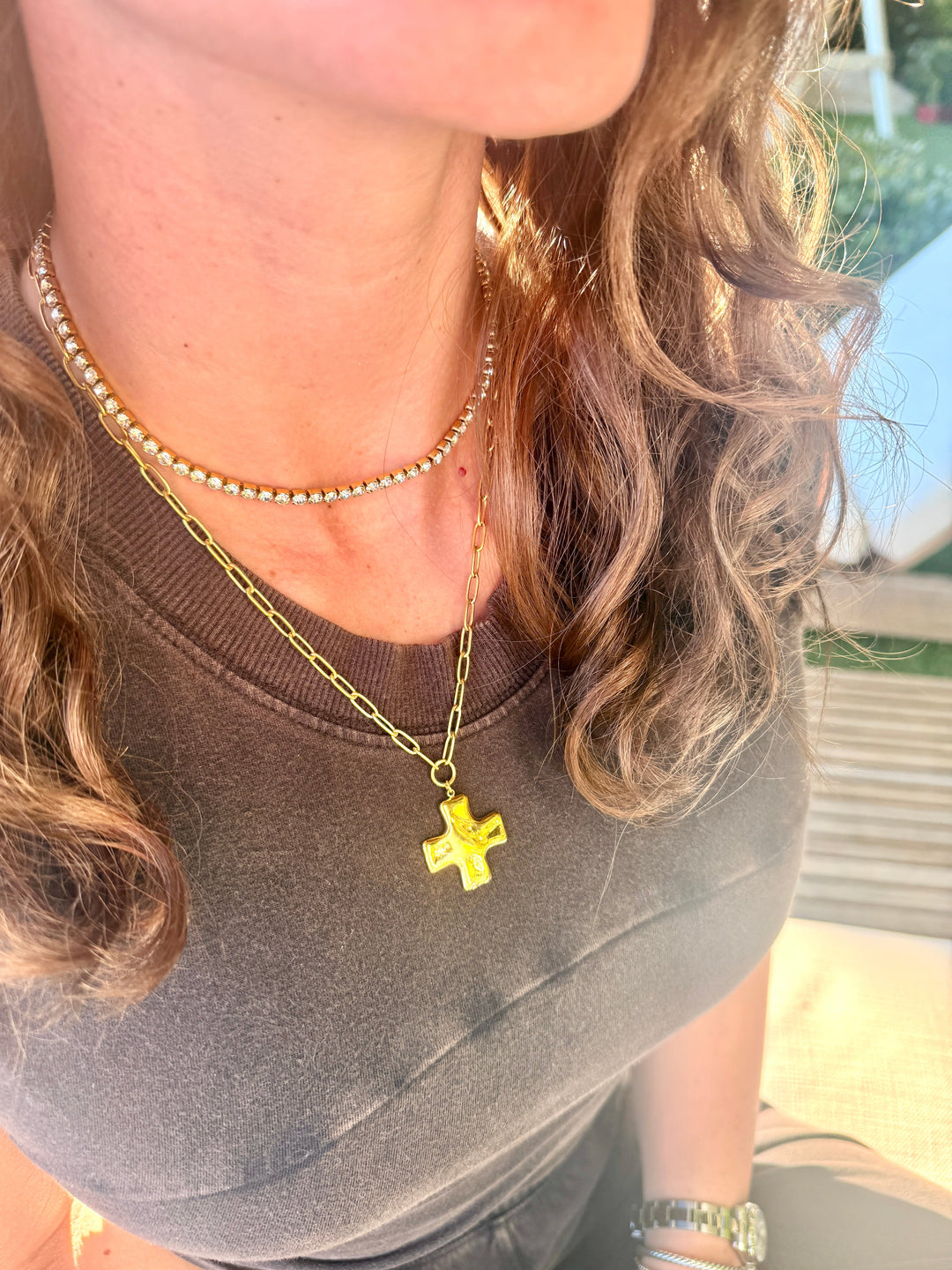 Gold-tone cross charm pendant necklace layered with a fine beaded chain