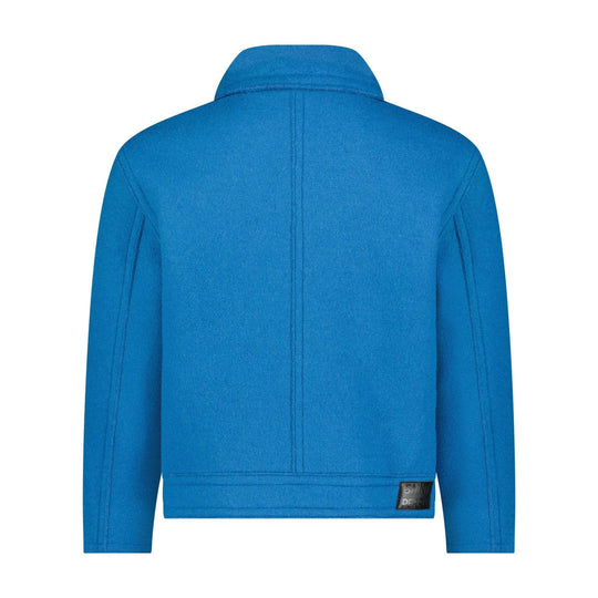 Blue boxy jacket back close-up: plain back yoke seam, hem band with small logo