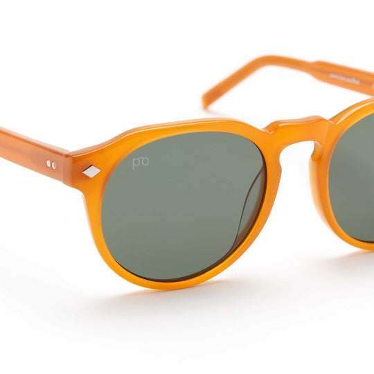 Tribe sunglasses close-up with Blood Orange frame and dark smoke lenses