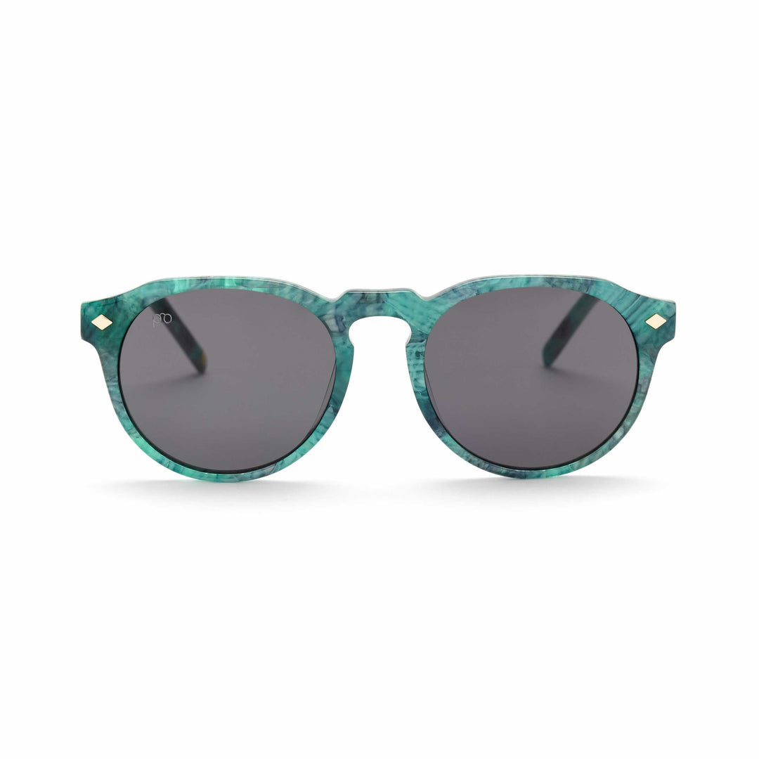 Tribe sunglasses in Iceberg Jade teal frame with dark smoke lenses, rounded cat-eye