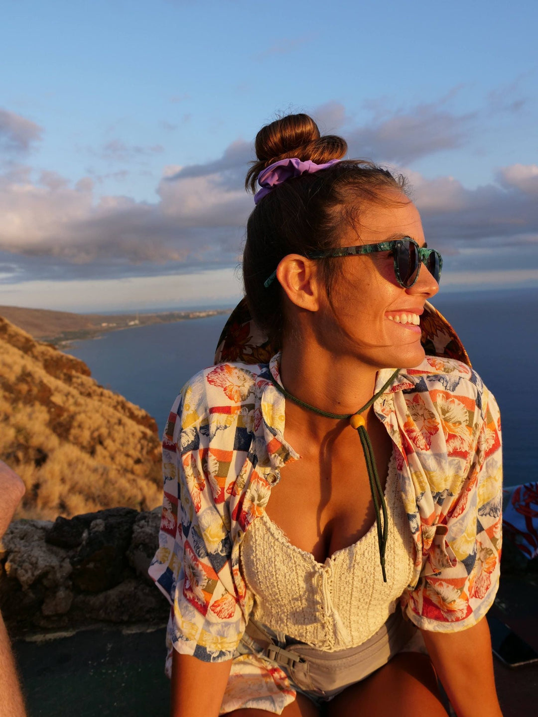 Tribe sunglasses with dark green frame and dark lenses worn by a person