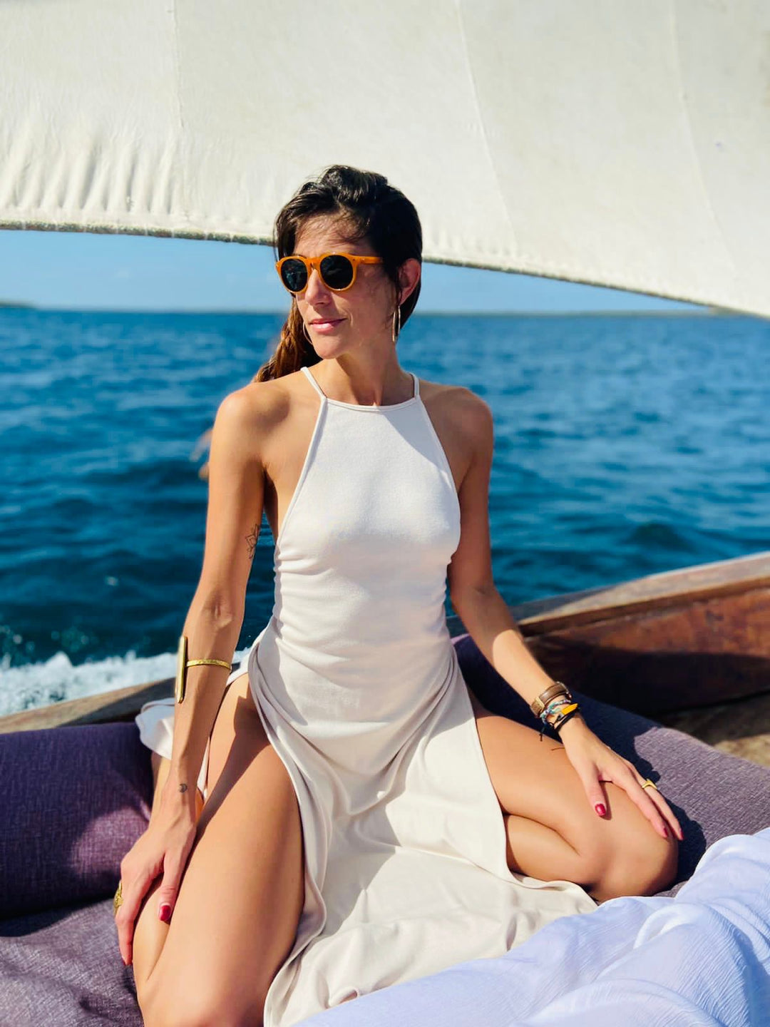Tribe sunglasses with tortoiseshell frame and green-tinted lenses worn
