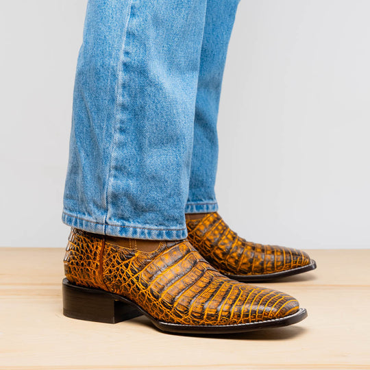 Tucson Mustard/Brown cowboy boots on model with jeans cuff, side profile