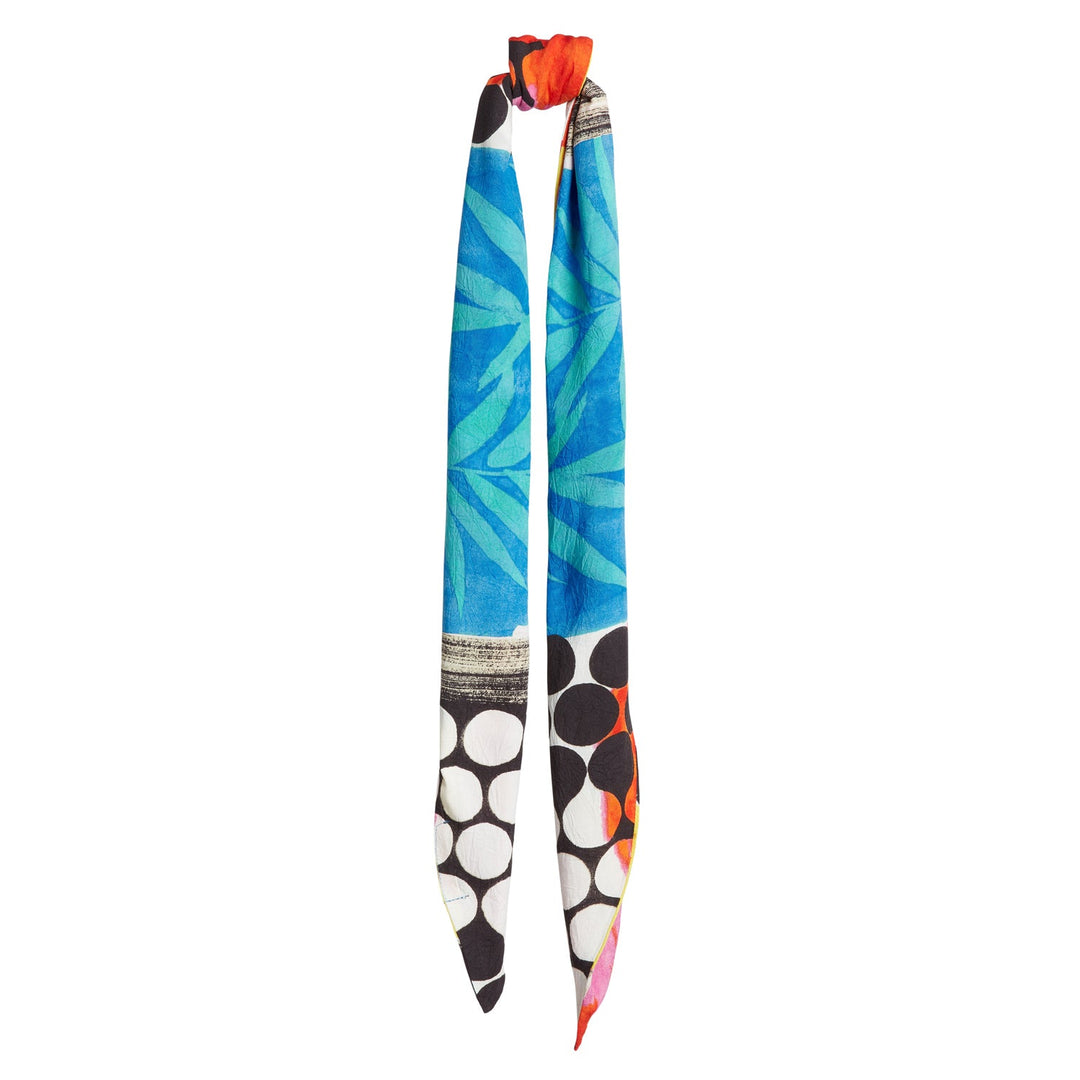 Headwrap long tie with blue-green leaf pattern, red knot accent, white/black circles