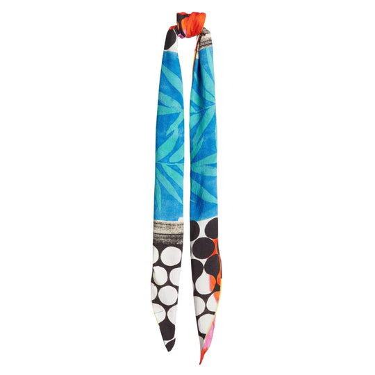 Headwrap long tie with blue-green leaf pattern, red knot accent, white/black circles