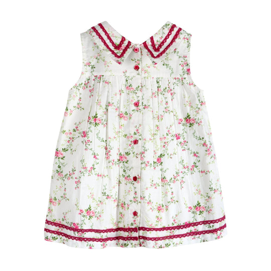 Front view white floral cotton dress with burgundy trim, button placket, pleated skirt