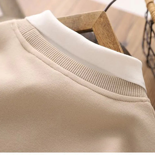 Beige hoodie neckline and ribbed cuffs detail on long sleeves