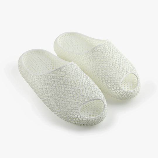 White 3D-printed slippers, two-piece pair with open toe and hexagonal honeycomb texture