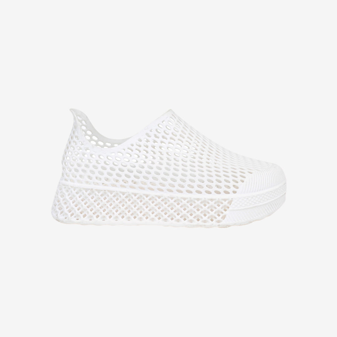 White 3D printed kids slip-on shoe with perforated mesh upper and cushioned sole