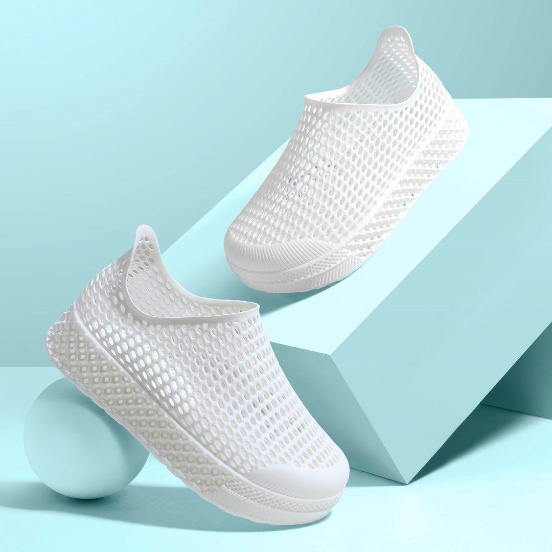 White 3D printed kids slip-on shoes with perforated mesh uppers and chunky sole