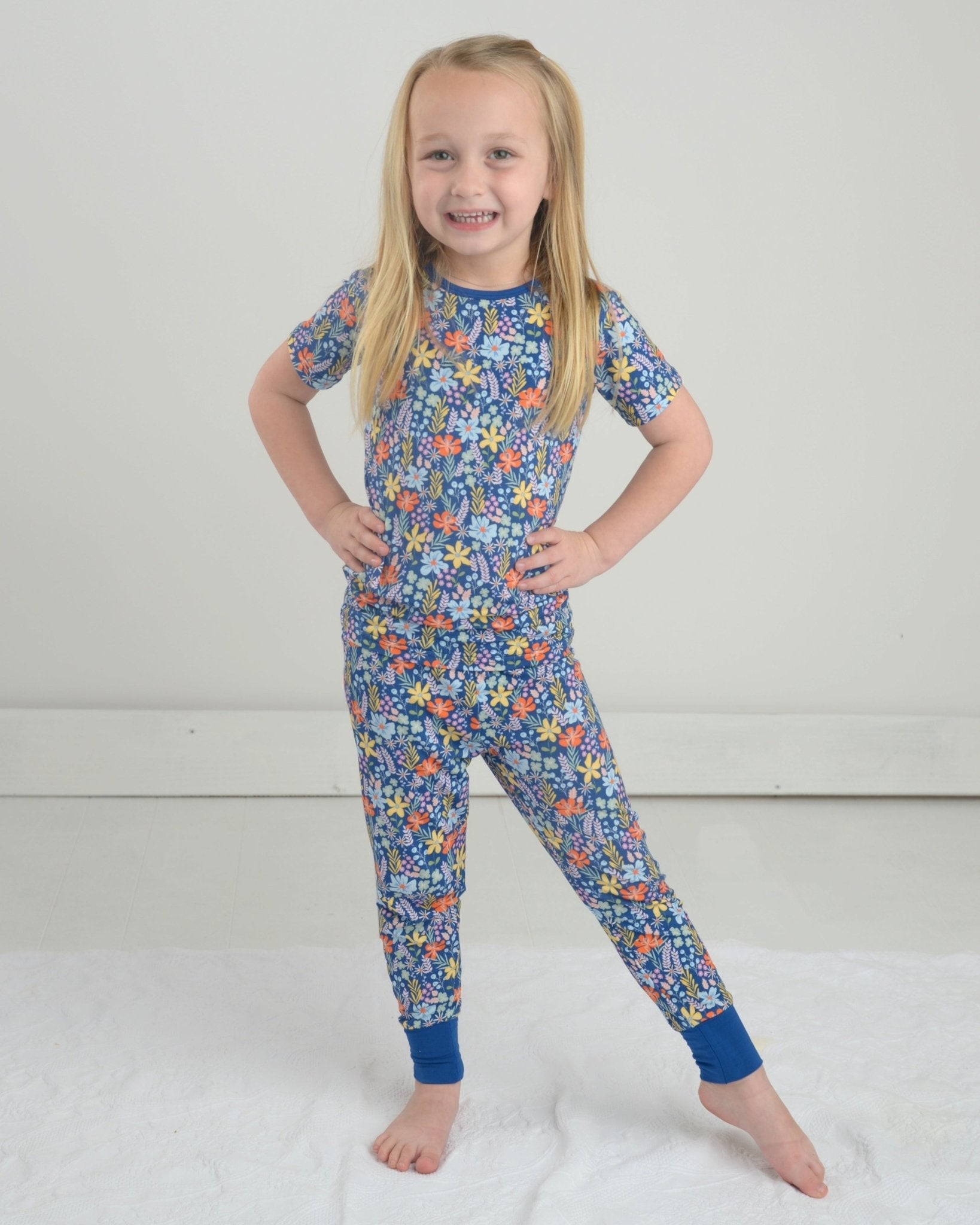 Wildflower pajama set with short-sleeve top and floral pants, blue with orange/yellow flowers