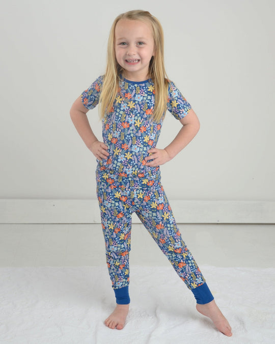 Wildflower pajama set with short-sleeve top and floral pants, blue with orange/yellow flowers